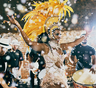 Buy stock photo Cropped shot of a beautiful samba dancer performing in a carnival with her band