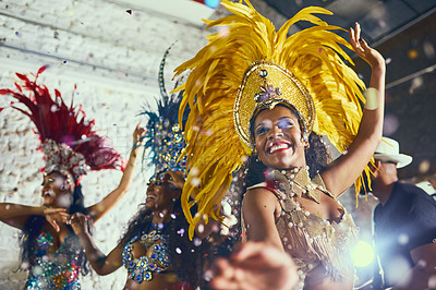 Buy stock photo Cropped shot of beautiful samba dancers performing in a carnival with their band