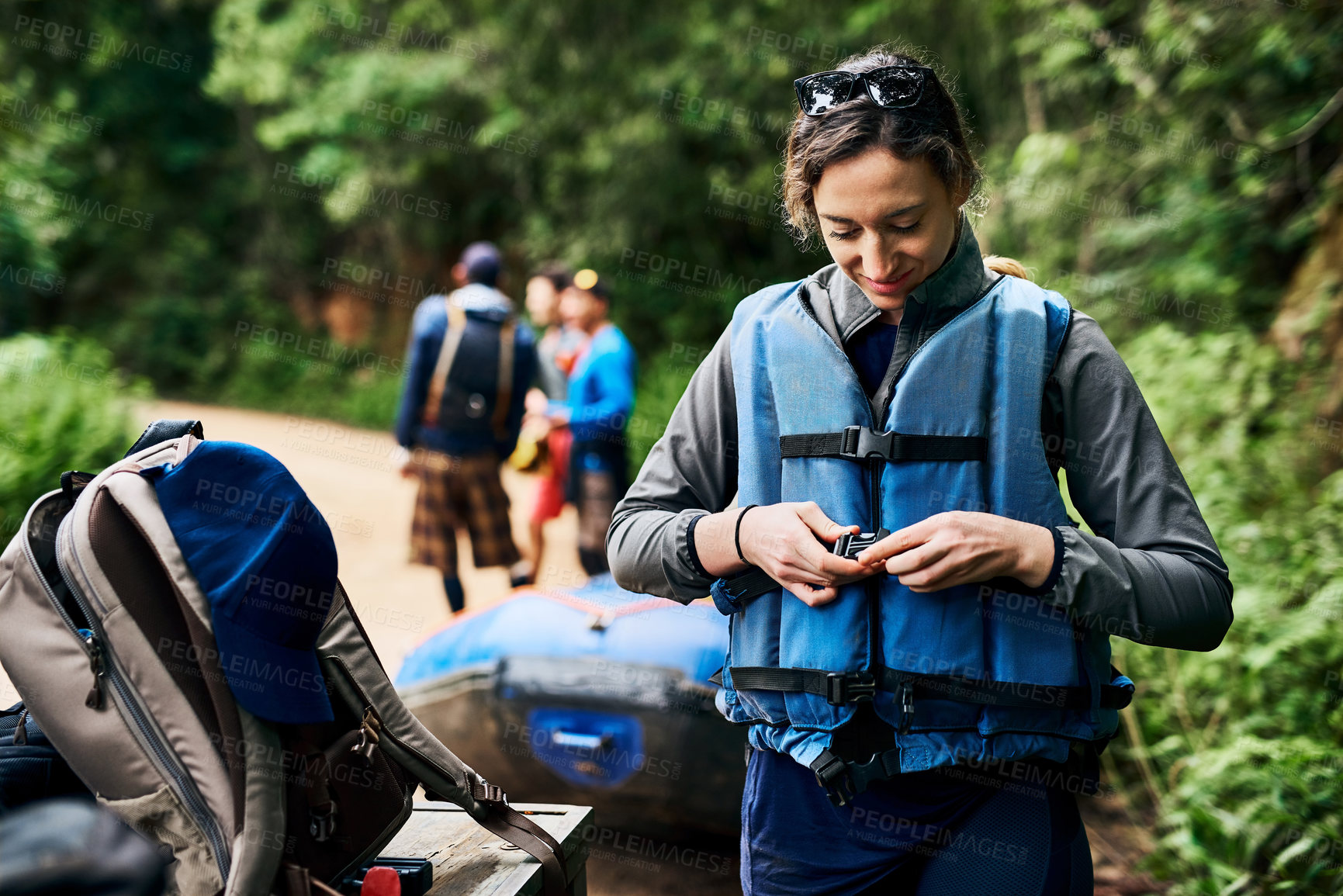 Buy stock photo Outdoor, woman and safety with jacket for rafting, challenge and competition with rafter for sports adventure. Female person, athlete and protection gear with pride for training, practice or nature