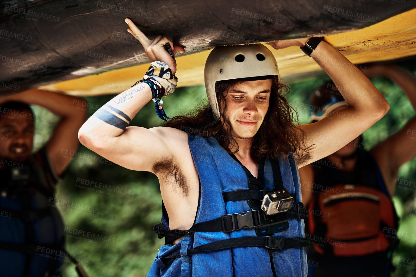 Buy stock photo Man, helmet and carrying boat with team or crew for adventure or outdoor ride in nature. Young, male person or group with life jacket, safety or vessel to set sail, canoe or extreme trip for kayaking