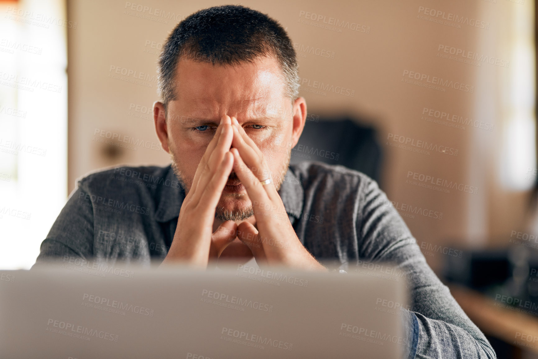 Buy stock photo Cropped shot of a man feeling stressed while working at home