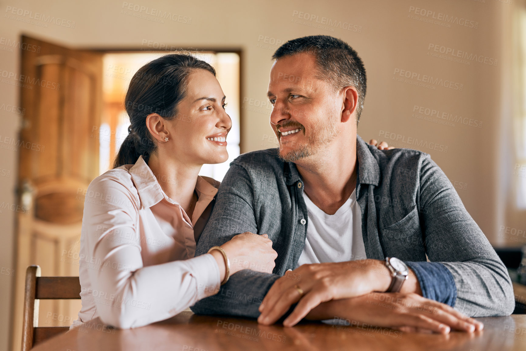 Buy stock photo Cropped shot of a married couple spending the day indoors