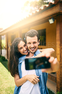 Buy stock photo Happy couple, hug and smile for selfie, profile picture or photo together in social media vlog outdoors. Man and woman hugging and smiling for memory, online post or capture outside their home