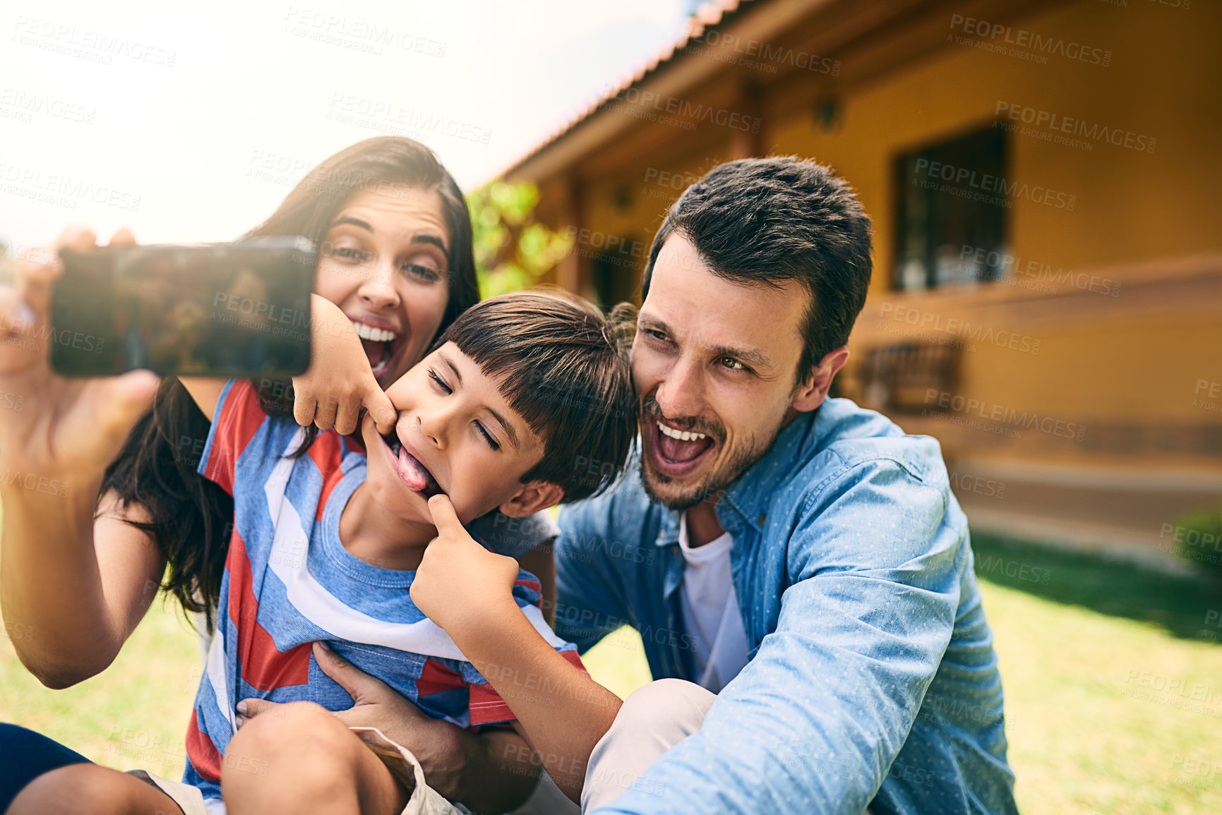 Buy stock photo Happy family, smile and silly face for selfie, funny photo or profile picture in social media vlog outside home. Mother, father and child smiling with goofy facial expression for fun memory together