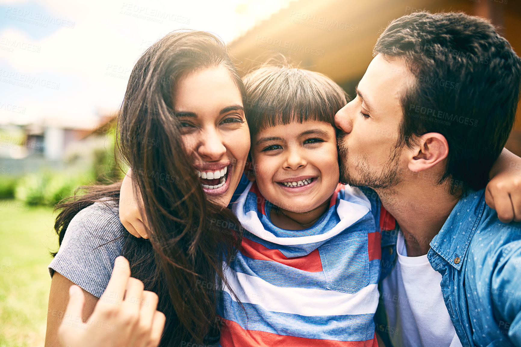 Buy stock photo Happy family, portrait and kiss child at garden for love, care and bonding together to relax with parents. Face, father and laughing mother with kid outdoor for support, connection and relationship