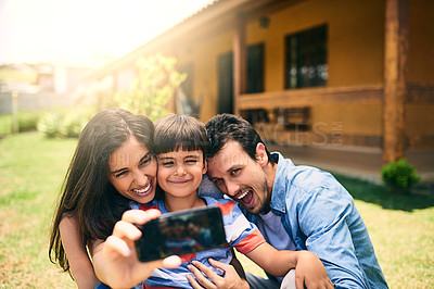 Buy stock photo Happy family, relax and smile for selfie, photo or profile picture in social media vlog outside home. Mother, father and child smiling for fun memory, online post or holiday weekend break together