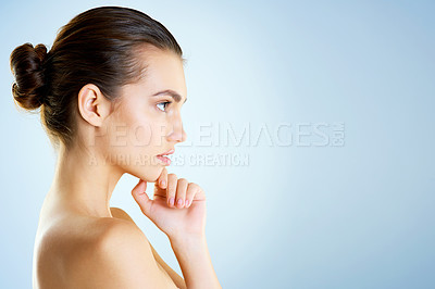 Buy stock photo Glow, woman and confident in studio background for skincare with routine and transformation for self care. Female person, profile and serious on mockup space with facial treatment and fresh look