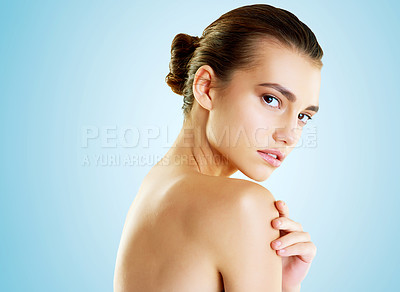 Buy stock photo Beauty, glow and portrait of woman in studio for cosmetics, collagen and facial. Self care, skincare and shine with face of female model on blue background for clean, natural makeup and spa mockup