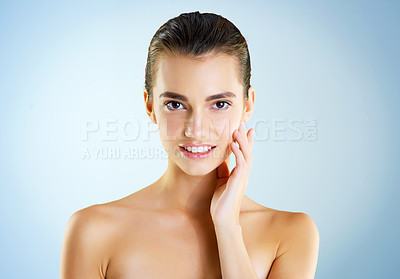 Buy stock photo Beauty, skincare and shine with portrait of woman in studio for cosmetics, collagen and facial. Self care, glow and salon with face of model on blue background for clean, natural makeup or spa mockup