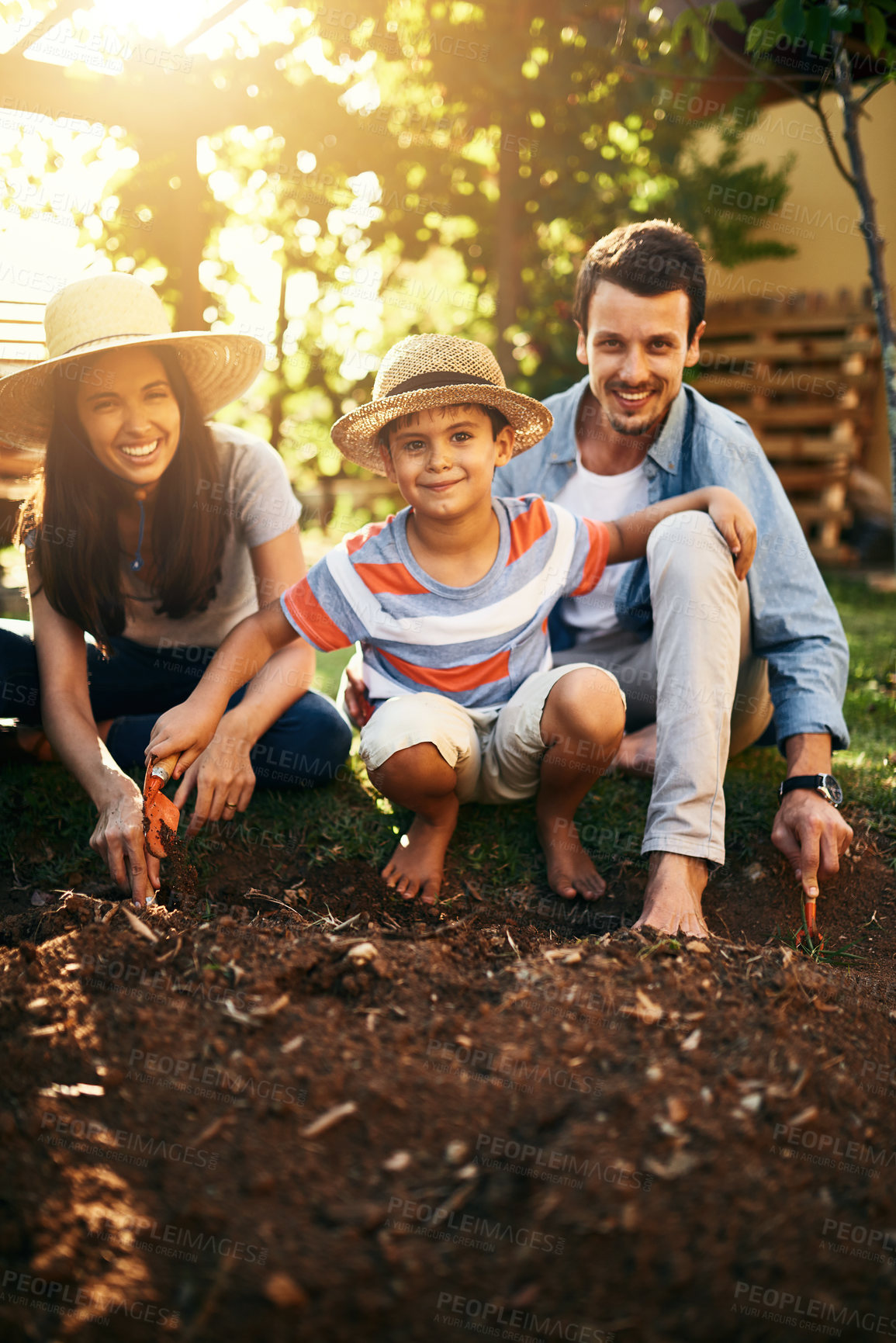 Buy stock photo Happy family, soil or plant in garden for sustainability, agriculture care or farming development. Backyard, learning natural growth or parents of boy child with sand or planting for teaching a child