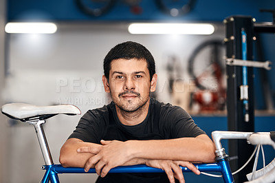 Buy stock photo Bike repair, maintenance and portrait with man in workshop for frame building or professional engineering. Assessment, bicycle and transport with confident mechanic in startup for restoration