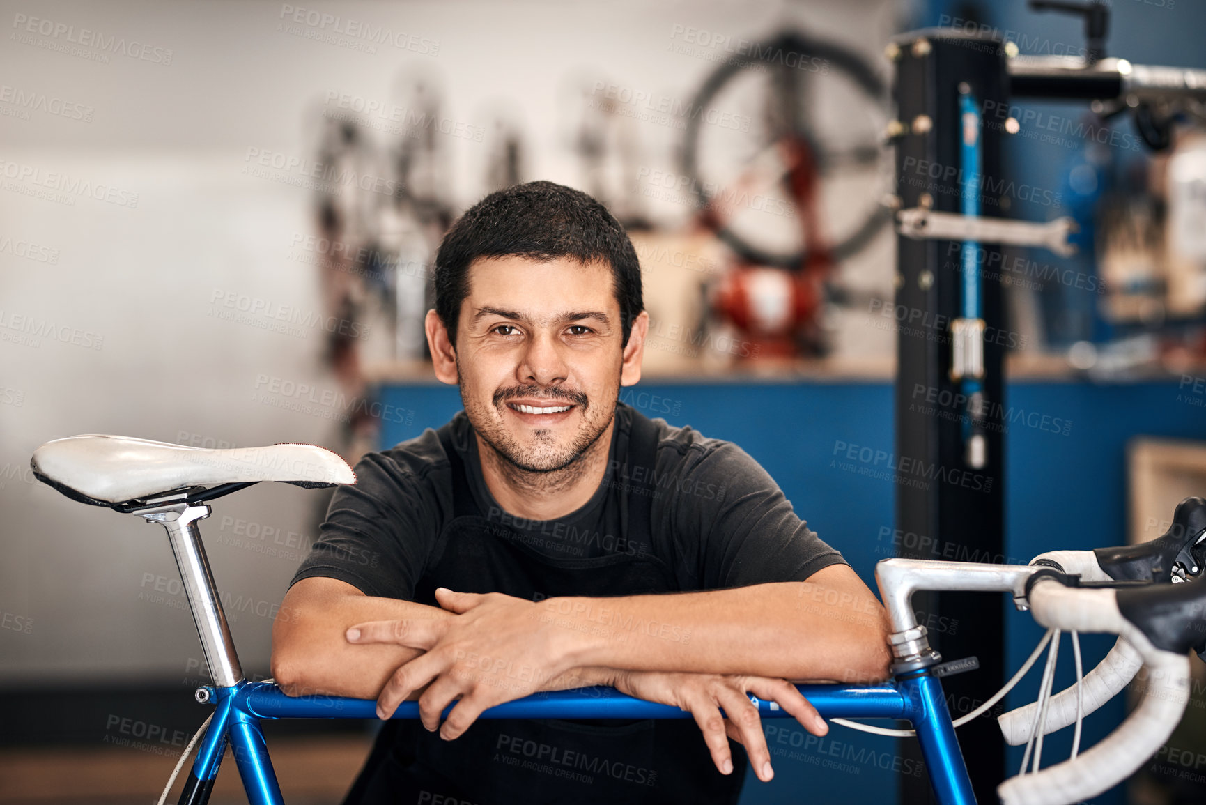 Buy stock photo Bicycle repair, maintenance and portrait with man in workshop for frame building or professional engineering. Assessment, bike and smile with mechanic or technician in startup to restore transport