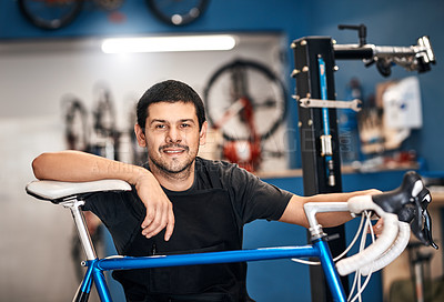 Buy stock photo Bike, portrait and repair with man in workshop for frame building, fixing or professional engineering. Assessment, bicycle and transport with happy mechanic or technician in startup for restoration