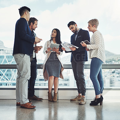 Buy stock photo Shot of a diverse group of businesspeople having a discussion in an office