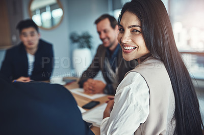 Buy stock photo Portrait of a young businessman sitting in a meeting in an office