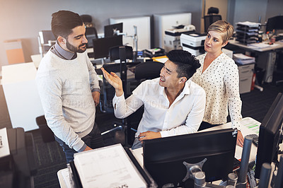 Buy stock photo Shot of creative colleagues working together in the office