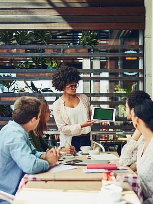 Buy stock photo Cropped shot of designers having a meeting at a coffee shop