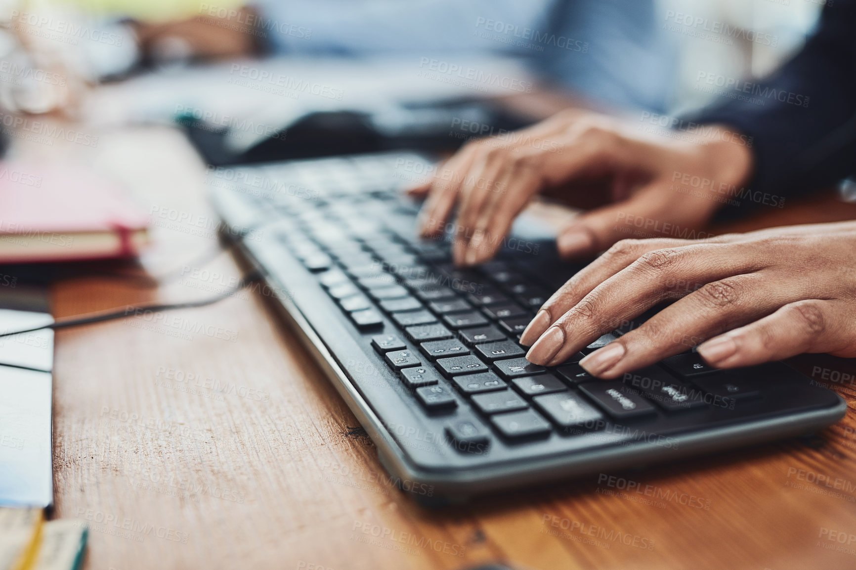 Buy stock photo Closeup shot of an unrecognizable businesswoman typing on a keyboard in an office
