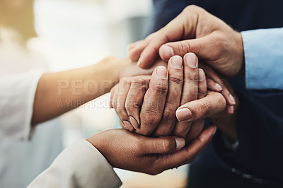 Buy stock photo Hand holding showing support, love and care. Close up of a group of people coming together in unity as a team. Friends bonding and building trust with loving gesture. Adults communicating friendship 