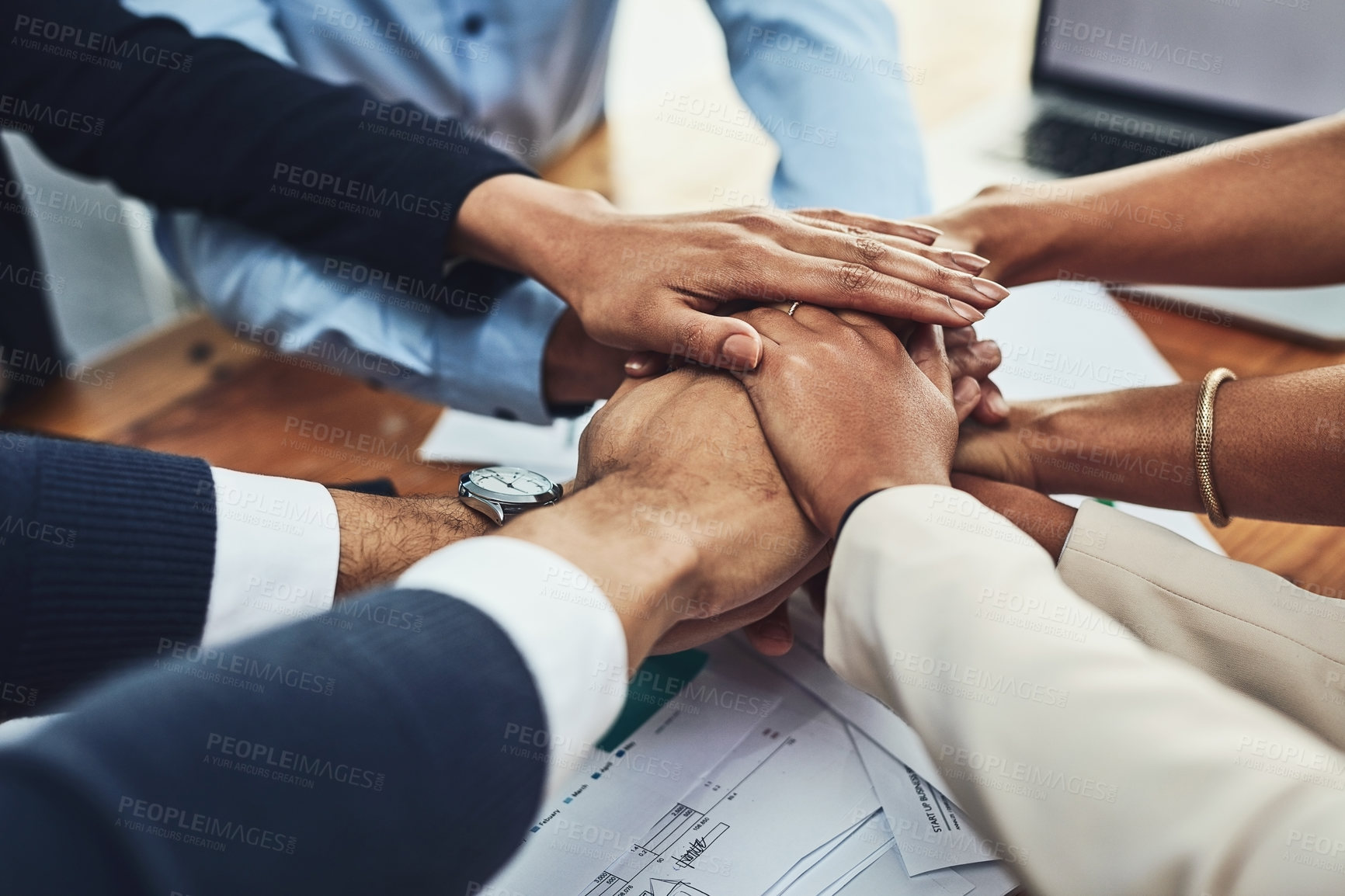 Buy stock photo Hands together, business people in meeting and solidarity, support and team huddle with collaboration. Group of employees working in office, teamwork and mission with hand stack over paperwork