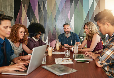 Buy stock photo Cropped shot of creative colleagues having a meeting in a modern office