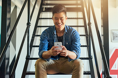 Buy stock photo Asian man, texting and office stairs with phone, smile and communication on social network app. Young japanese businessman, web design startup and relax on steps in workplace for chat with smartphone