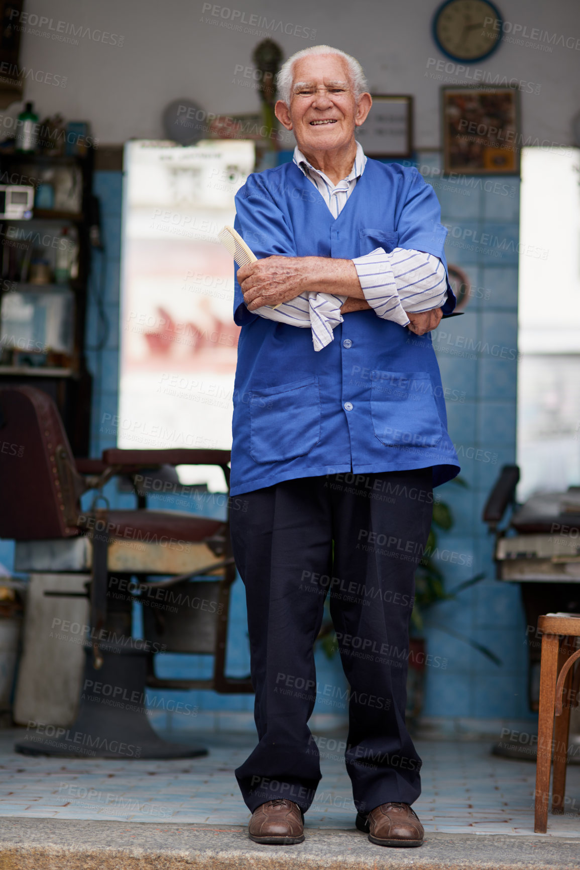 Buy stock photo Shot of a senior man in his barber shop