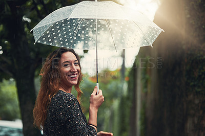 Buy stock photo Portrait, rain and happy woman with umbrella outdoor for protection, shield and waterproof at park. Face, smile and person with parasol for wet spring weather, travel and funny tourist laugh in USA