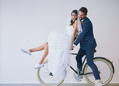 Buy stock photo Happy couple, wedding bride and groom on bicycle for travel, laughing or love. Newlyweds, man and woman on bike for marriage, cycling or celebrate romantic honeymoon together on white wall background