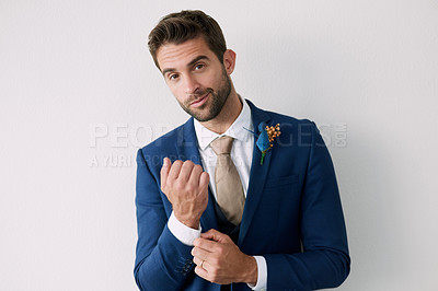 Buy stock photo Studio portrait of a handsome young groom against a gray background