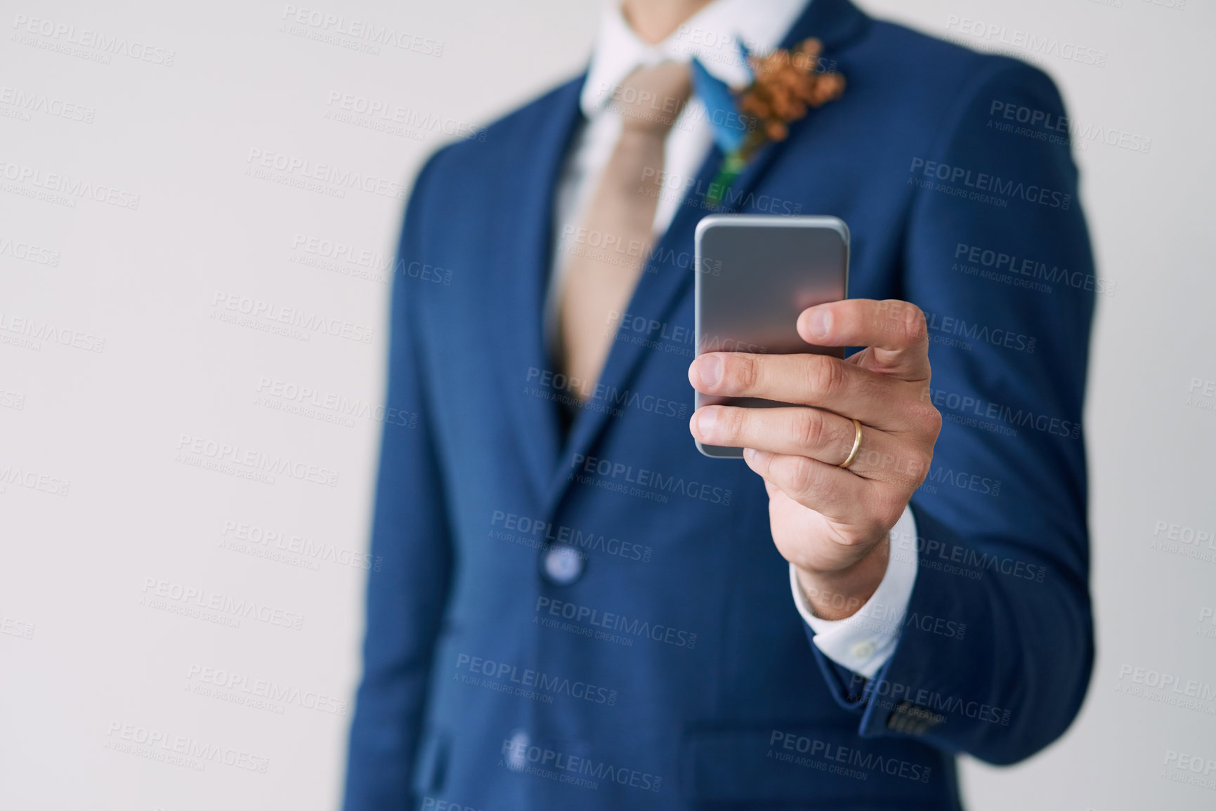 Buy stock photo Hand, groom and smartphone in studio for marriage with digital, wedding schedule and relationship trust. Social media, status update and commitment for man, suit and partnership on white background