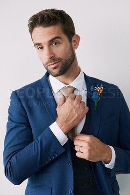 Buy stock photo Studio shot of a handsome young groom against a gray background