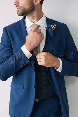 Buy stock photo Cropped studio shot of a stylish young groom against a gray background