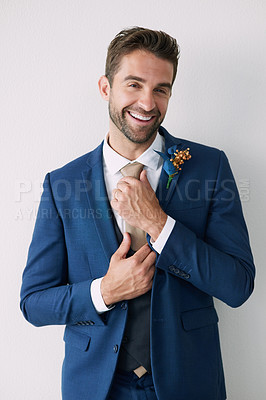 Buy stock photo Portrait, wedding and tie with happy groom ready for marriage ceremony against white wall background. Fashion, smile and man dressing in suit, smart and formal for love celebration and commitment