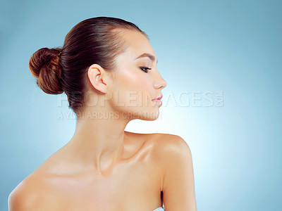 Buy stock photo Skincare, cosmetics and woman in studio, thinking and wellness with treatment, shine and confident in spa. Blue background, beauty and dermatology for skin, relax and proud of hydration and mockup