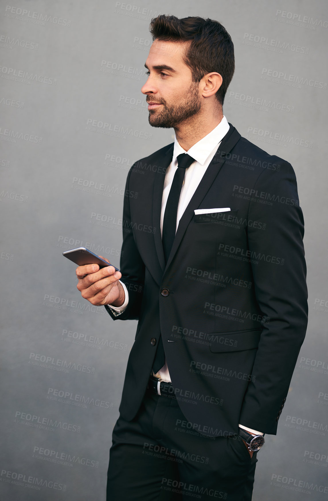 Buy stock photo Business man, phone and confidence with tech, idea and social media break in studio. Suit, corporate and executive fashion with mobile networking, worker and professional style with gray background