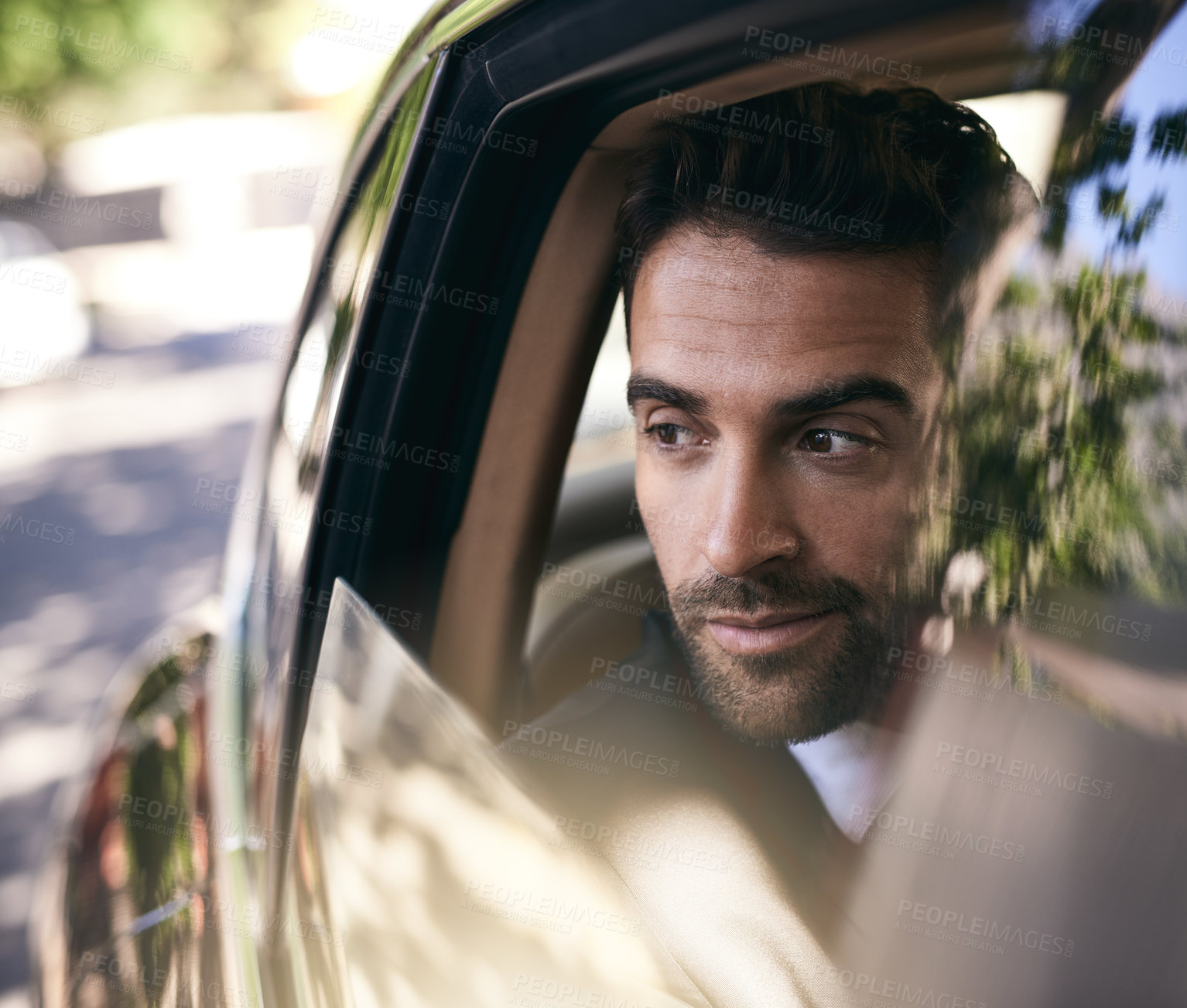 Buy stock photo Cropped shot of a handsome young businessman on his morning commute to work