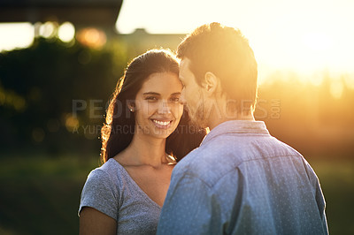 Buy stock photo Portrait of a young woman bonding with her boyfriend outdoors