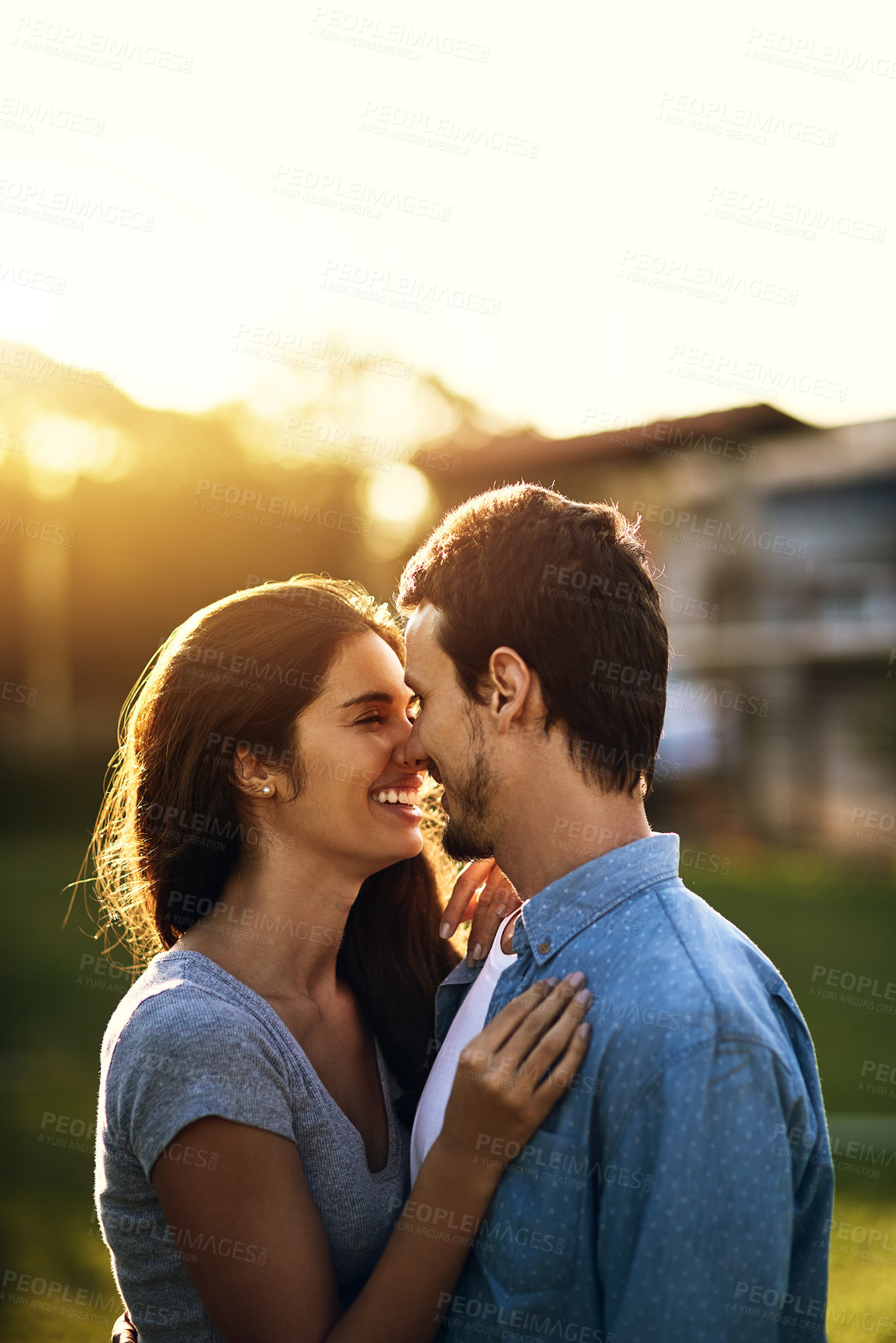 Buy stock photo Nose, touch and happy couple outdoor at sunset for love, care and bonding together at park. Date, man and woman at garden for commitment, support and connection for romantic relationship on vacation