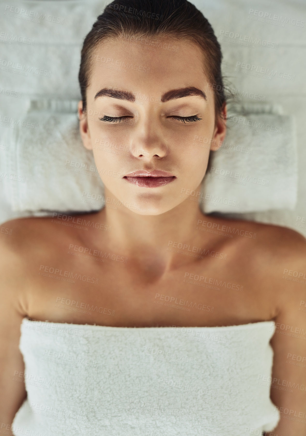 Buy stock photo Shot of an attractive young woman getting pampered at a beauty spa