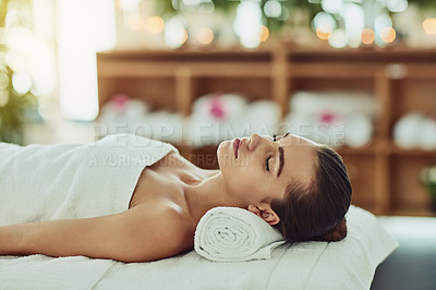 Buy stock photo Girl, sleeping and relax on towel at spa for luxury treatment, chemical peel and body massage for pamper. Person, resting or wellness at beauty salon with zen, serene and cosmetic facial for skincare