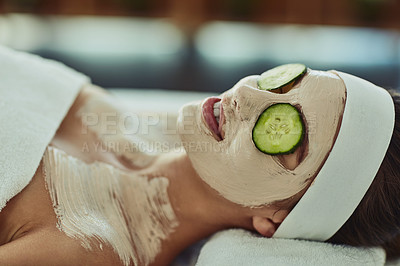 Buy stock photo Shot of an attractive young woman relaxing on a massage bed at a beauty spa