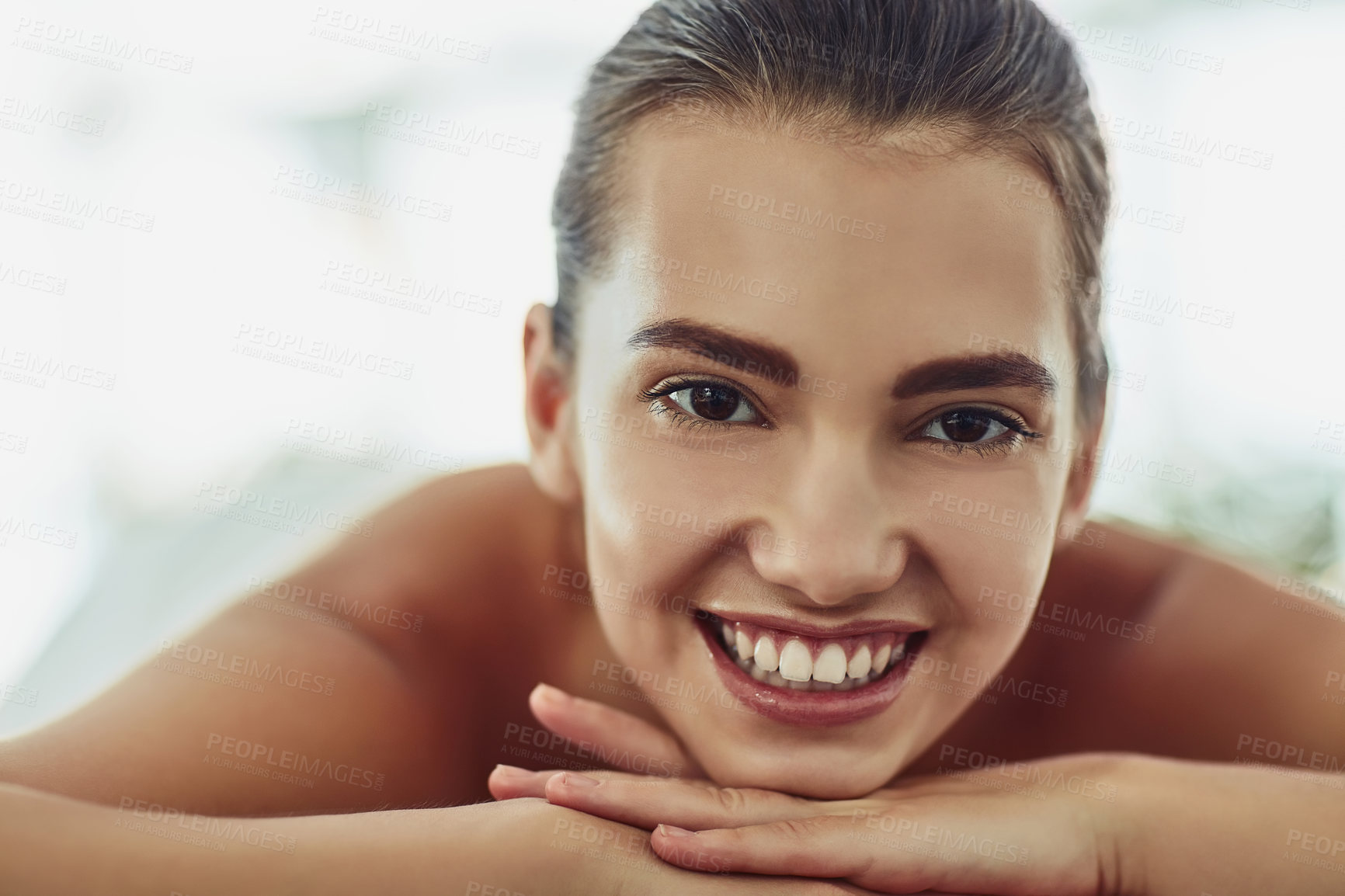 Buy stock photo Portrait of an attractive young woman getting pampered at a beauty spa