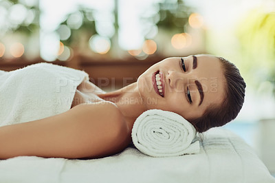 Buy stock photo Woman, smile and relax on towel at spa for luxury treatment, chemical peel and body massage for pamper. Person, happy and wellness at beauty salon with zen, comfort and cosmetic facial for skincare