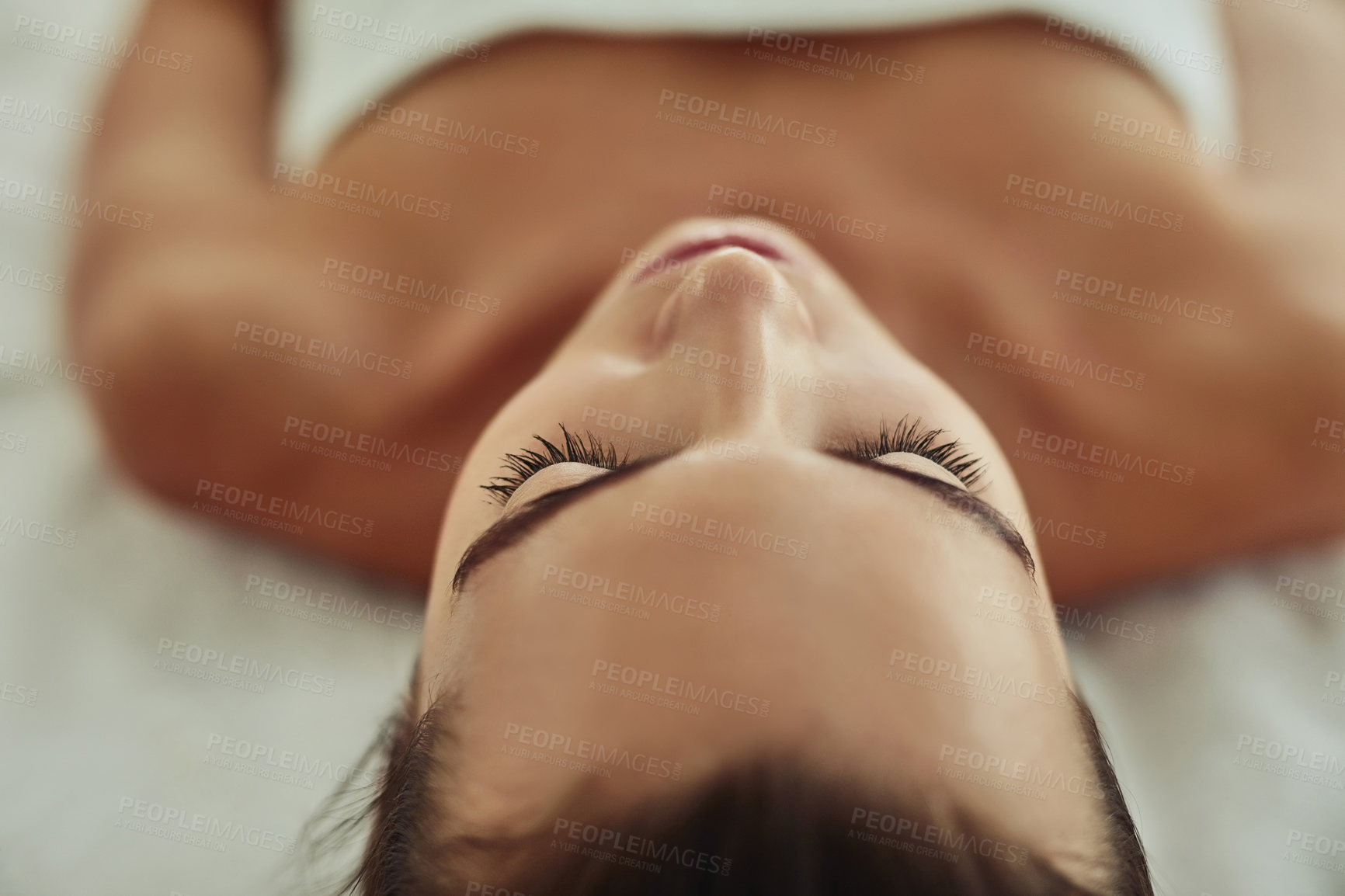 Buy stock photo Shot of an attractive young woman getting pampered at a beauty spa