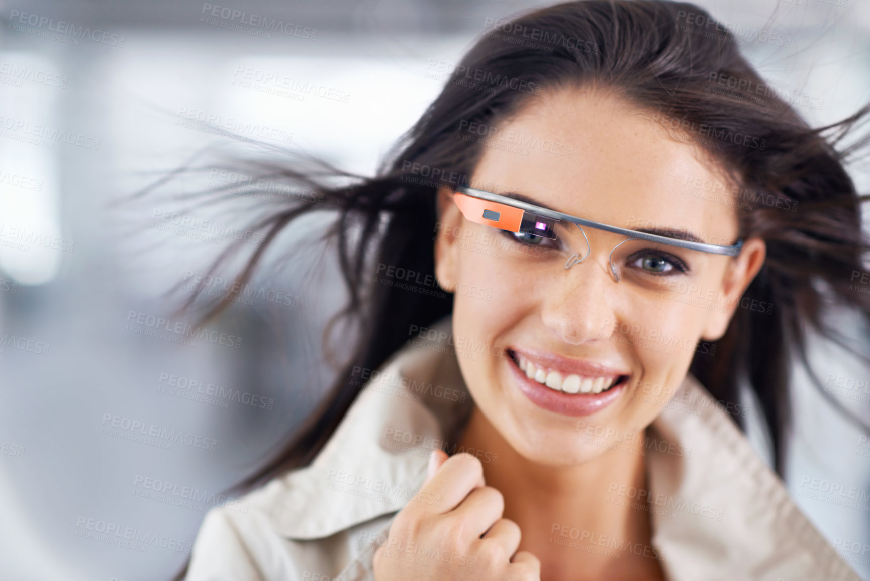 Buy stock photo Cropped portrait of an attractive young businesswoman using smartglasses in her office