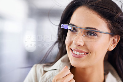Buy stock photo Cropped shot of an attractive young businesswoman using smartglasses in her office