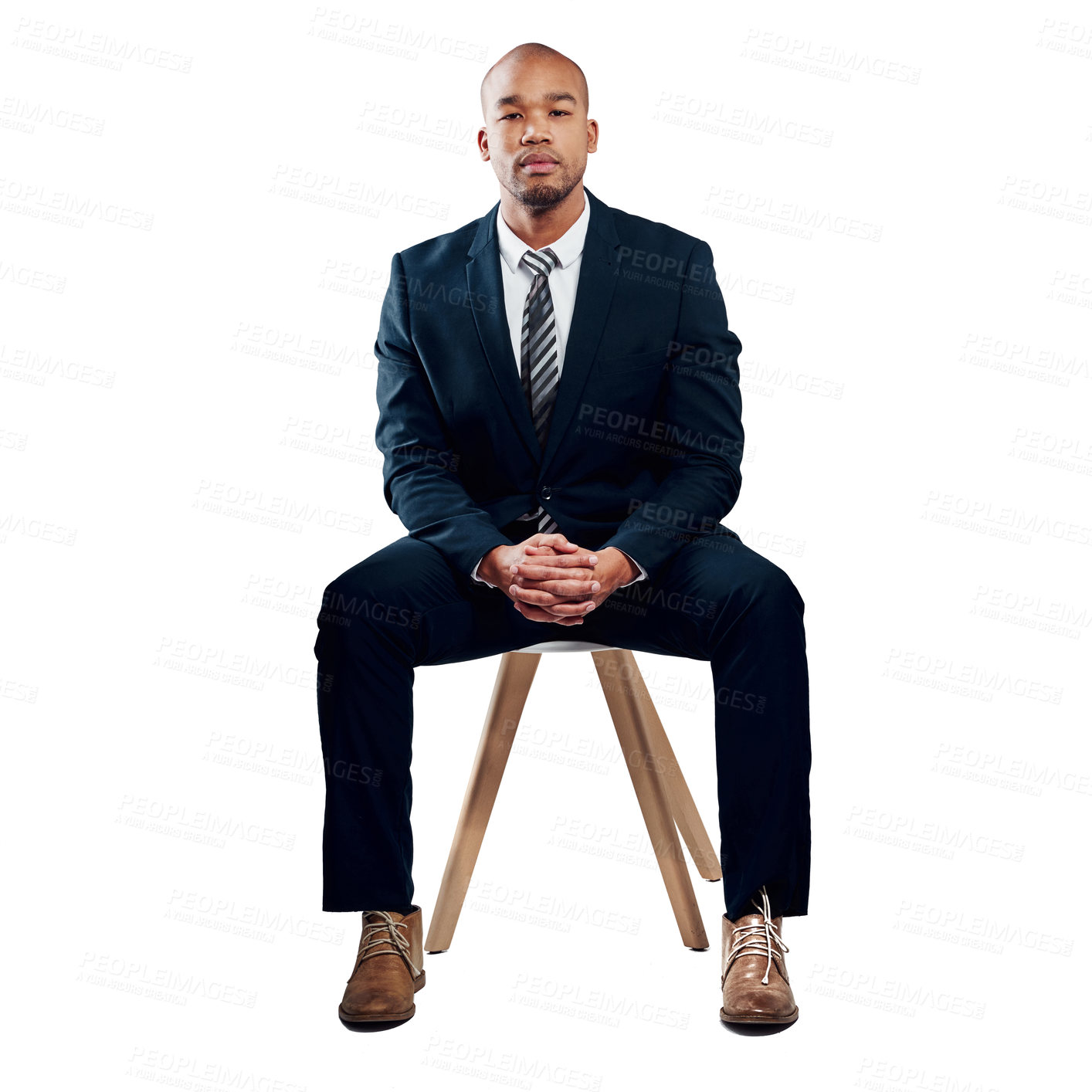 Buy stock photo Studio shot of a handsome young businessman posing against a white background