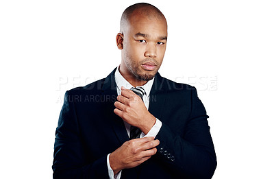 Buy stock photo Studio shot of a handsome young businessman fixing his sleeve against a white background