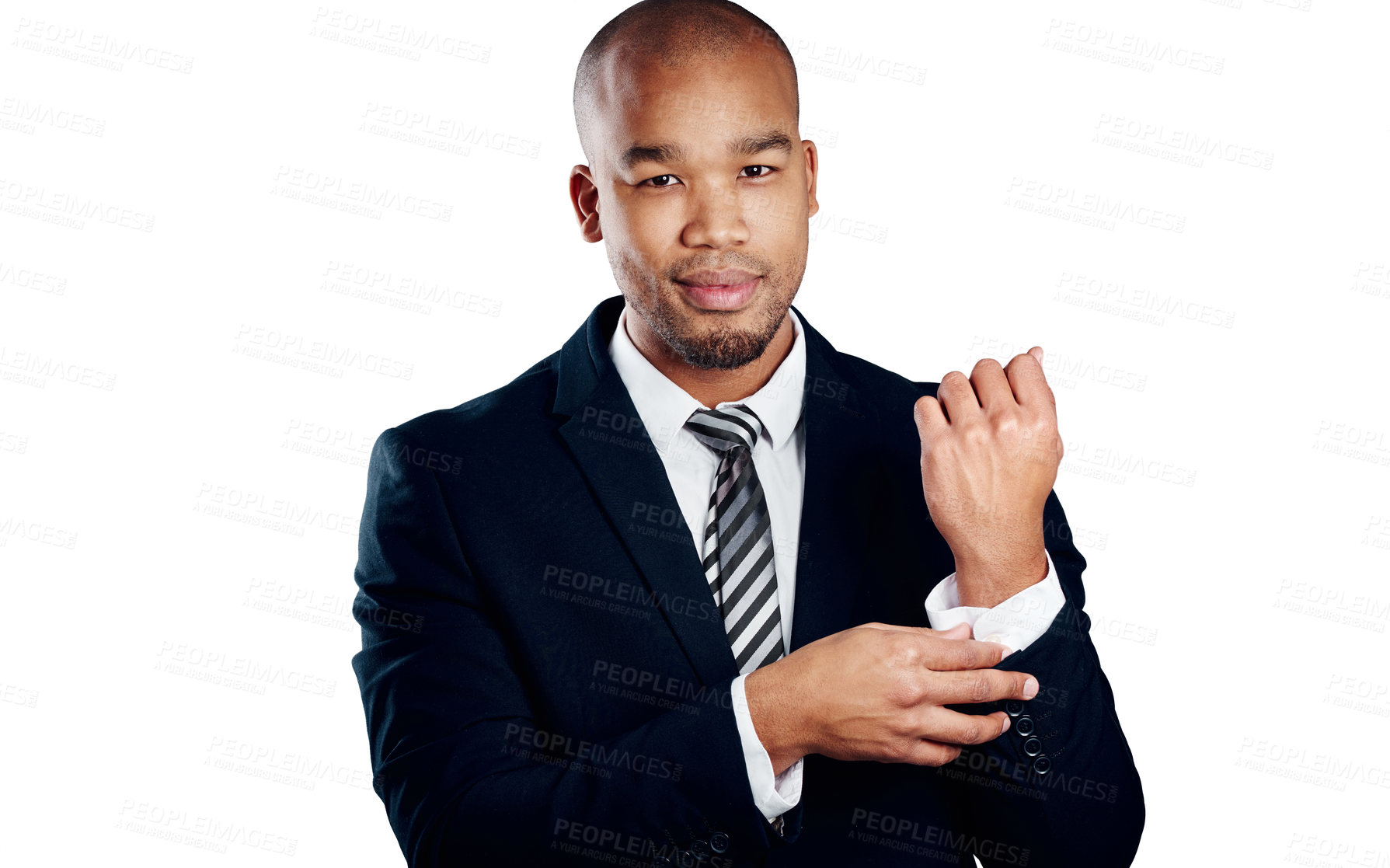 Buy stock photo Studio shot of a handsome young businessman fixing his sleeve against a white background